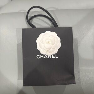CHANEL small  Black Bag with White Floral Detail